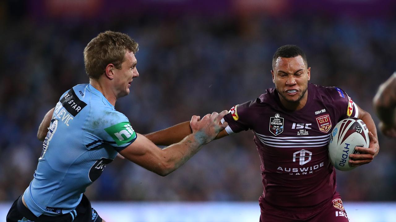 Moses Mbye of the Maroons is tackled during game three of the 2019 State of Origin series between the New South Wales Blues and the Queensland Maroons at ANZ Stadium on July 10, 2019 in Sydney, Australia. (Photo by Cameron Spencer/Getty Images)