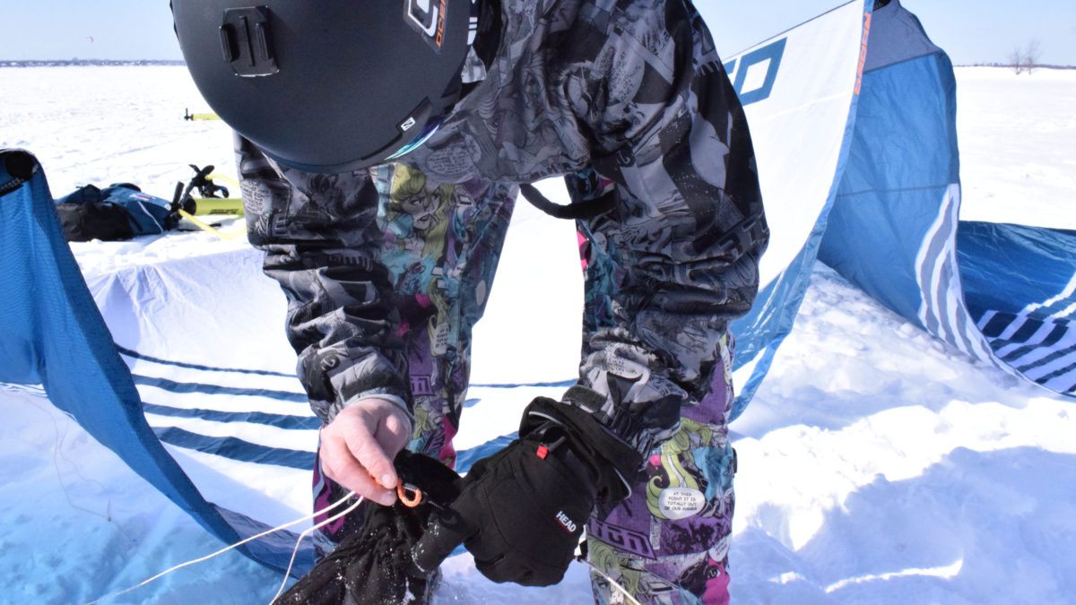 Campbell hooks a wire to his kite.