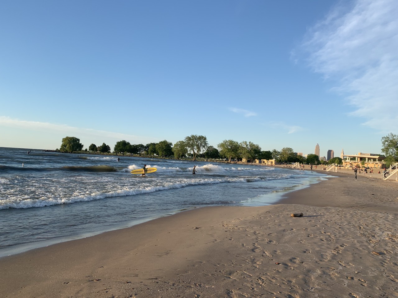 Surfers catch waves at Cleveland's Edgewater Beach.