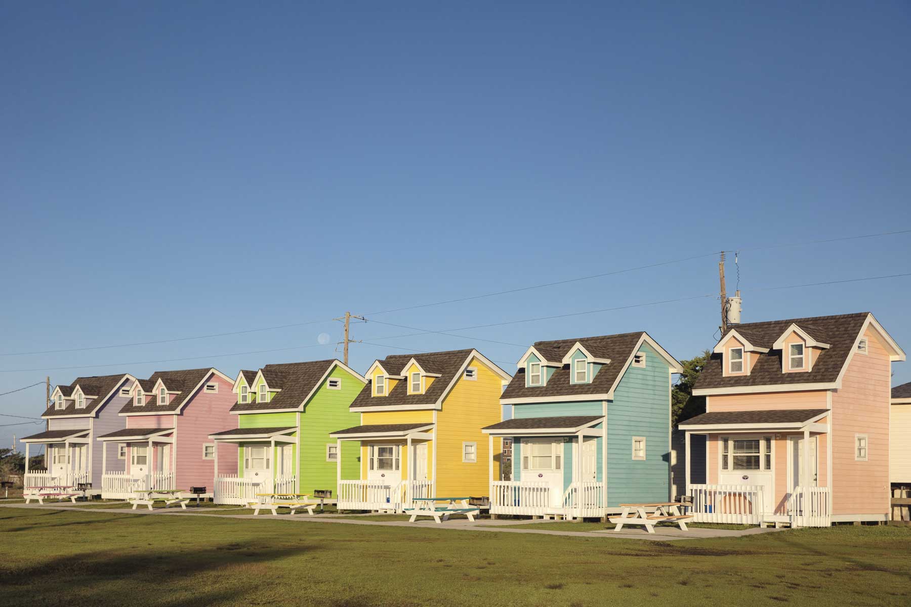 Hatteras Camping Resort cabins in cute pastel colors in Outer Banks, North Carolina